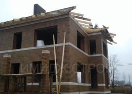Коричневый дом 182 кв.м. в стиле Райт плюс встроенный гараж на одну машину