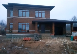 Коричневый дом 182 кв.м. в стиле Райт плюс встроенный гараж на одну машину